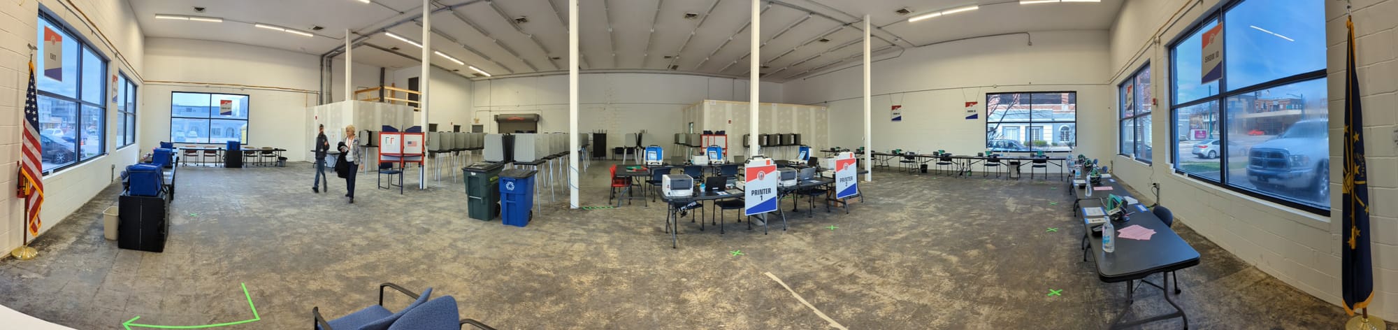 interior of voting operations showing booths and printers. It's a panorama.