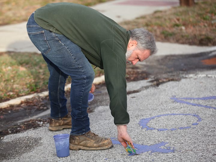 Bloomington gives $500 fine after activist writes “VOTE” on street, cites code on defacing property